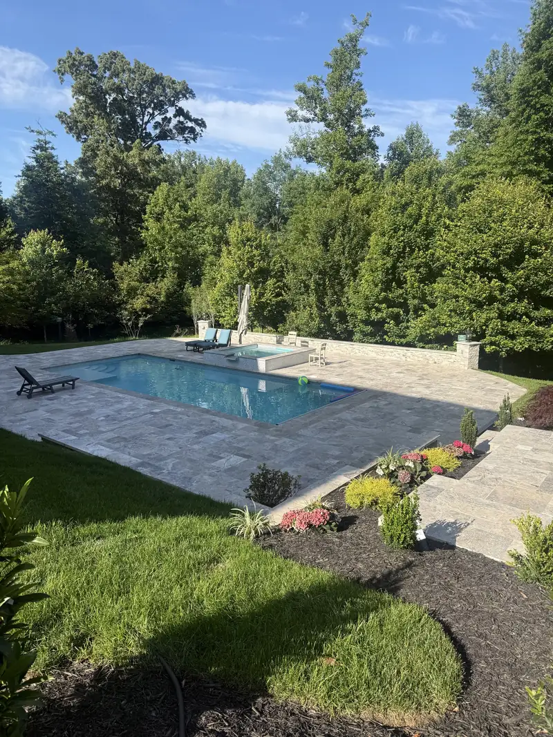 Paver patio and pool built by NC Landscaping