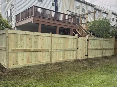 Wood privacy fence with gate